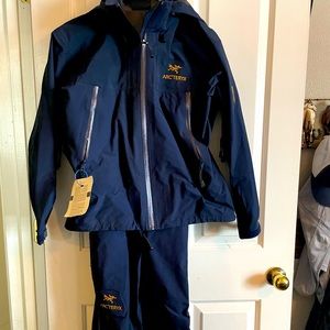 Women’s Arcteryx ski jacket with overalls ski pants.